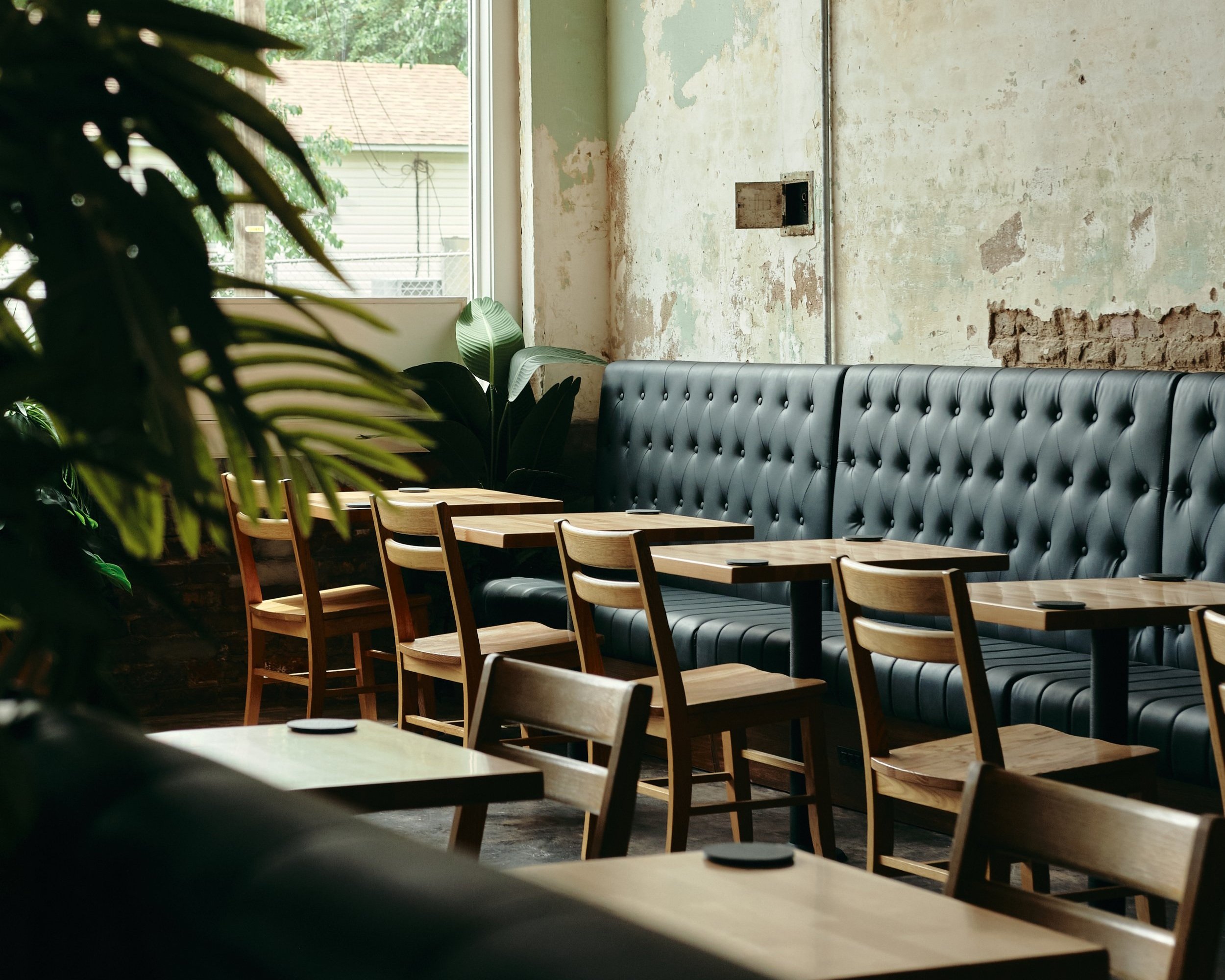 Industrial-chic meeting room for small-group networking and breakout sessions at Switchyards.