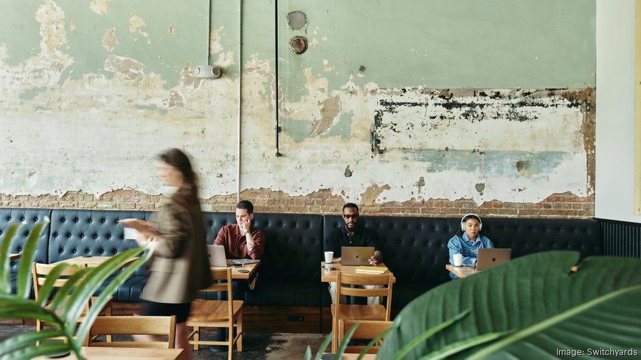 Modern industrial co-working meeting room for remote work and business events.