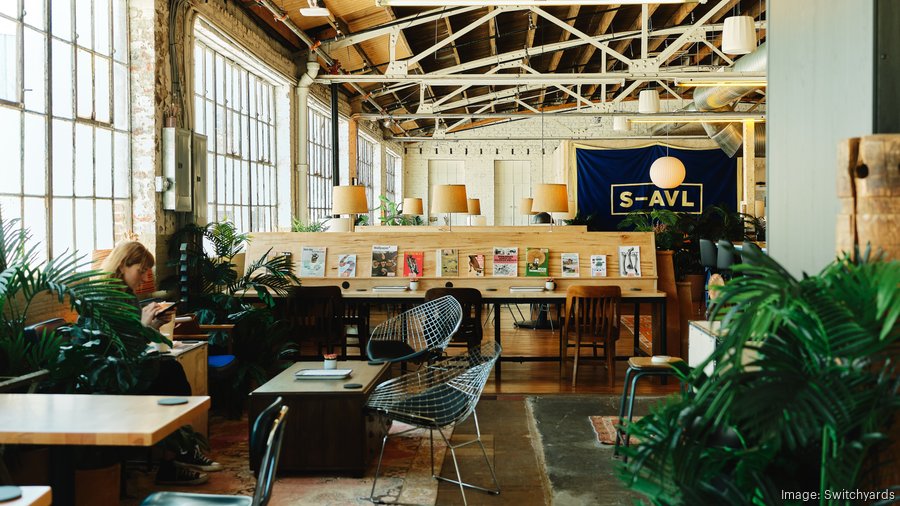 Industrial co-working meeting room with natural light for creative off-sites and team workshops.