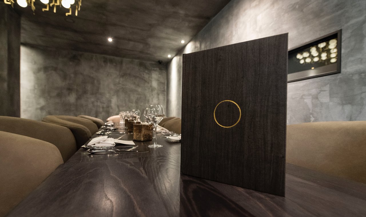 Private dining room at Opheem with minimalist decor for luxury corporate dinner events.