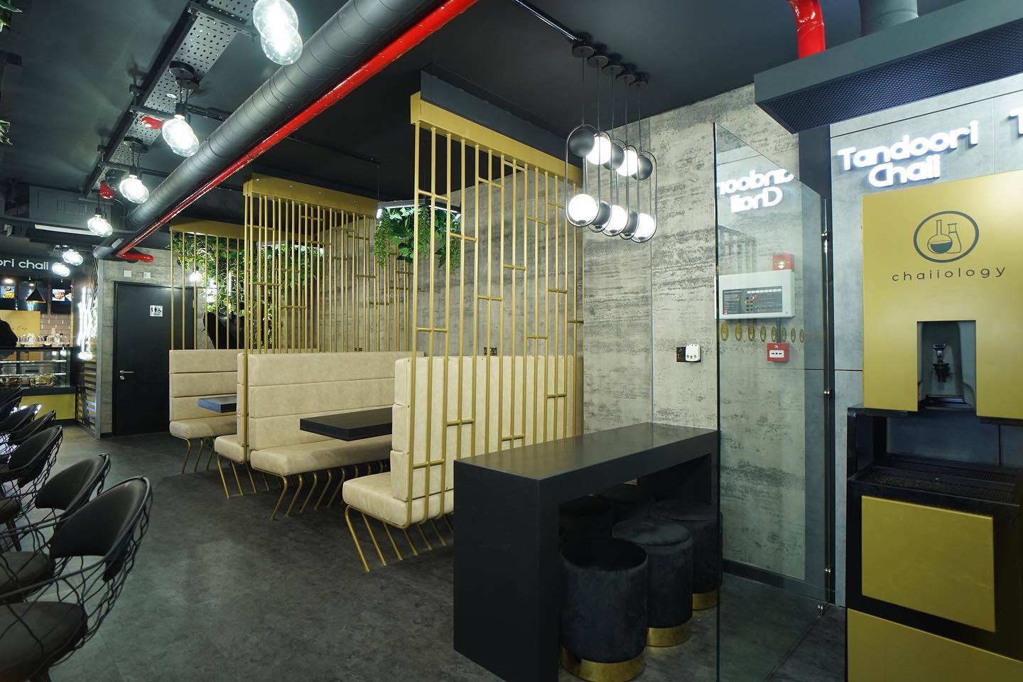 Chaiiology restaurant with industrial-chic booths for networking events and breakout sessions.