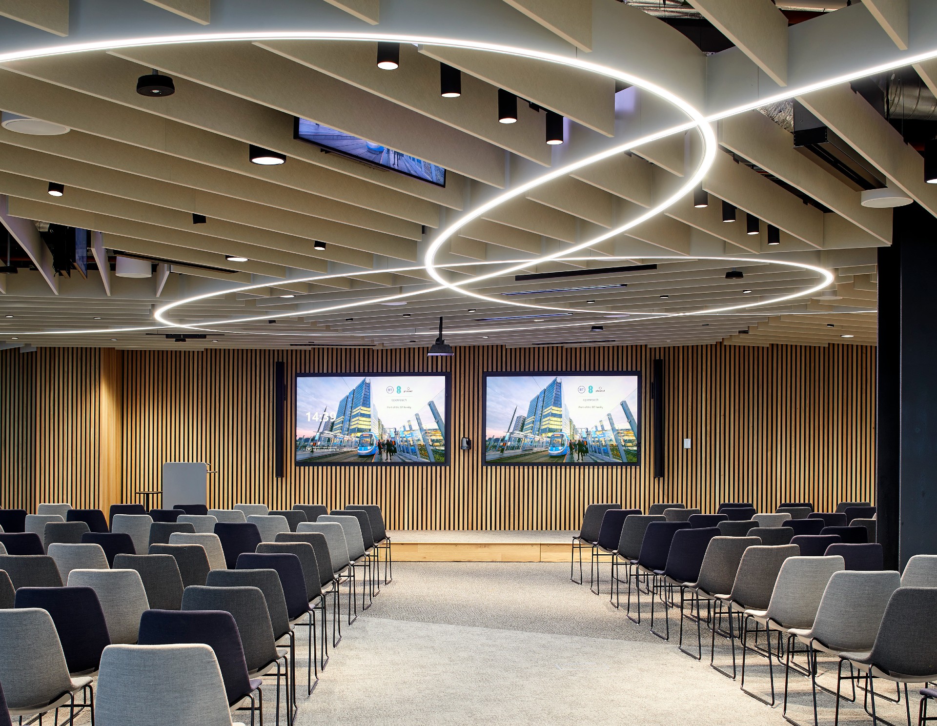 Modern tiered conference room with LED lighting for corporate presentations and keynote events.