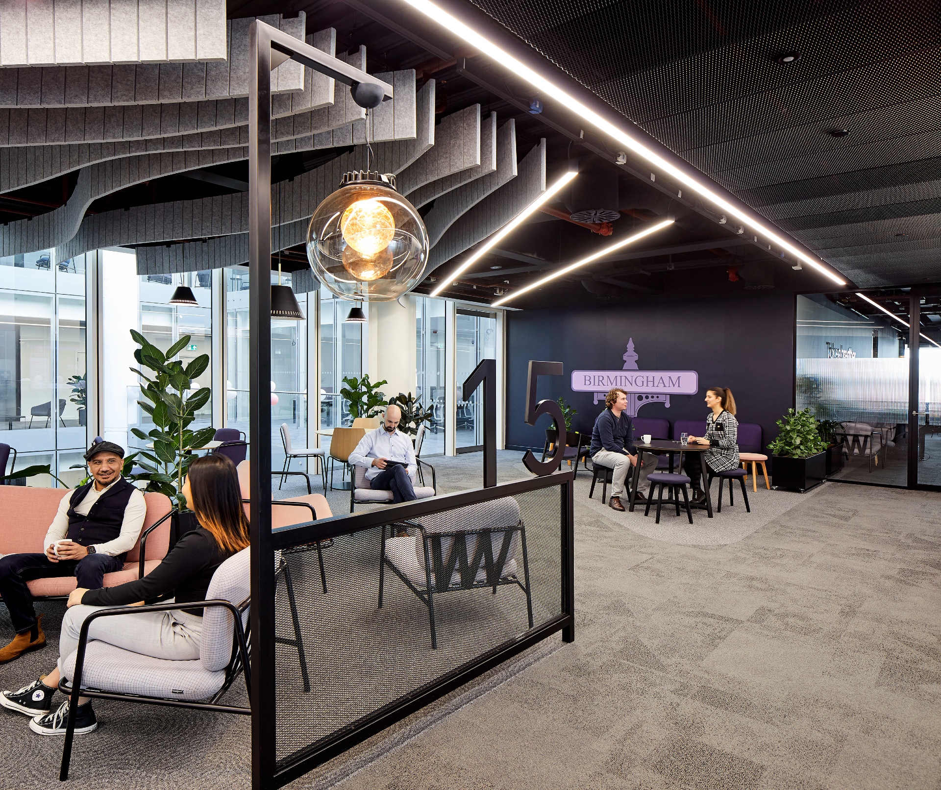 Modern corporate breakout space for flexible collaboration and office event planning.