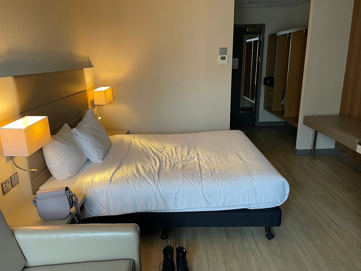 AC Hotel suite with desk for business conferences and corporate travel stays.