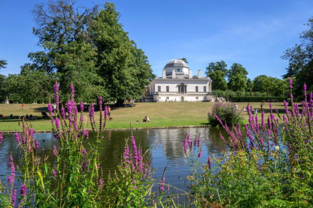 Chiswick House venue with serene water backdrop, ideal for events and gatherings.
