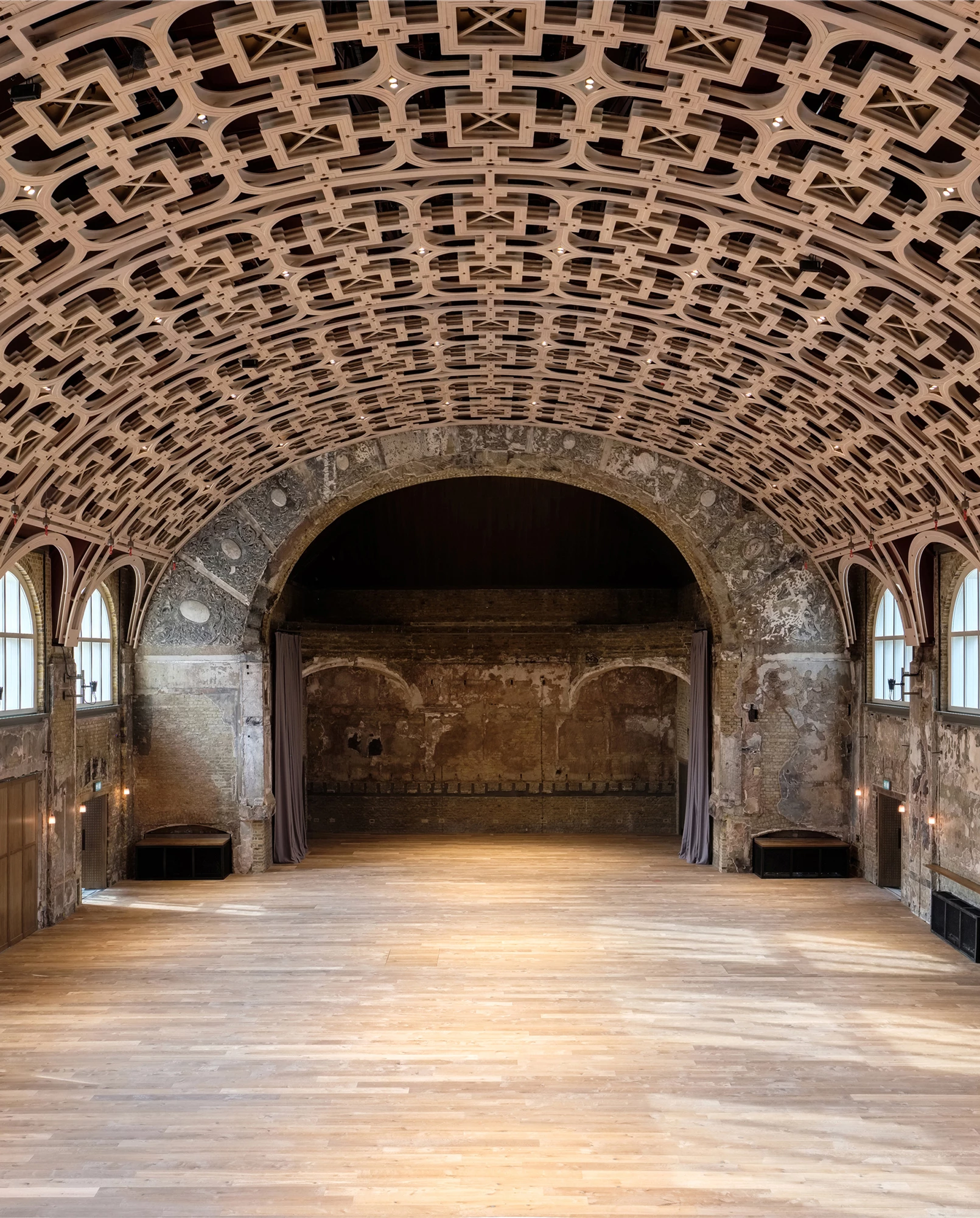 Spacious Battersea Arts Centre studio with intricate ceiling, ideal for unique events.