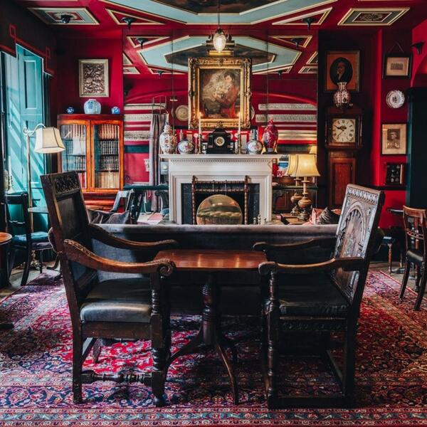 Intimate Tea House meeting space with vintage decor for brainstorming sessions.