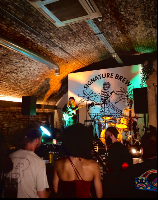 Industrial venue for experiential events with vibrant lighting and branding.