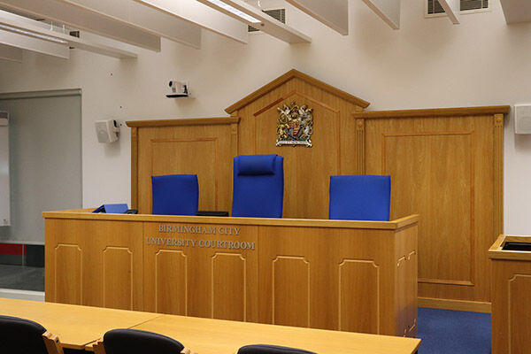 Mock courtroom at University of Law Birmingham for legal events and panel discussions.