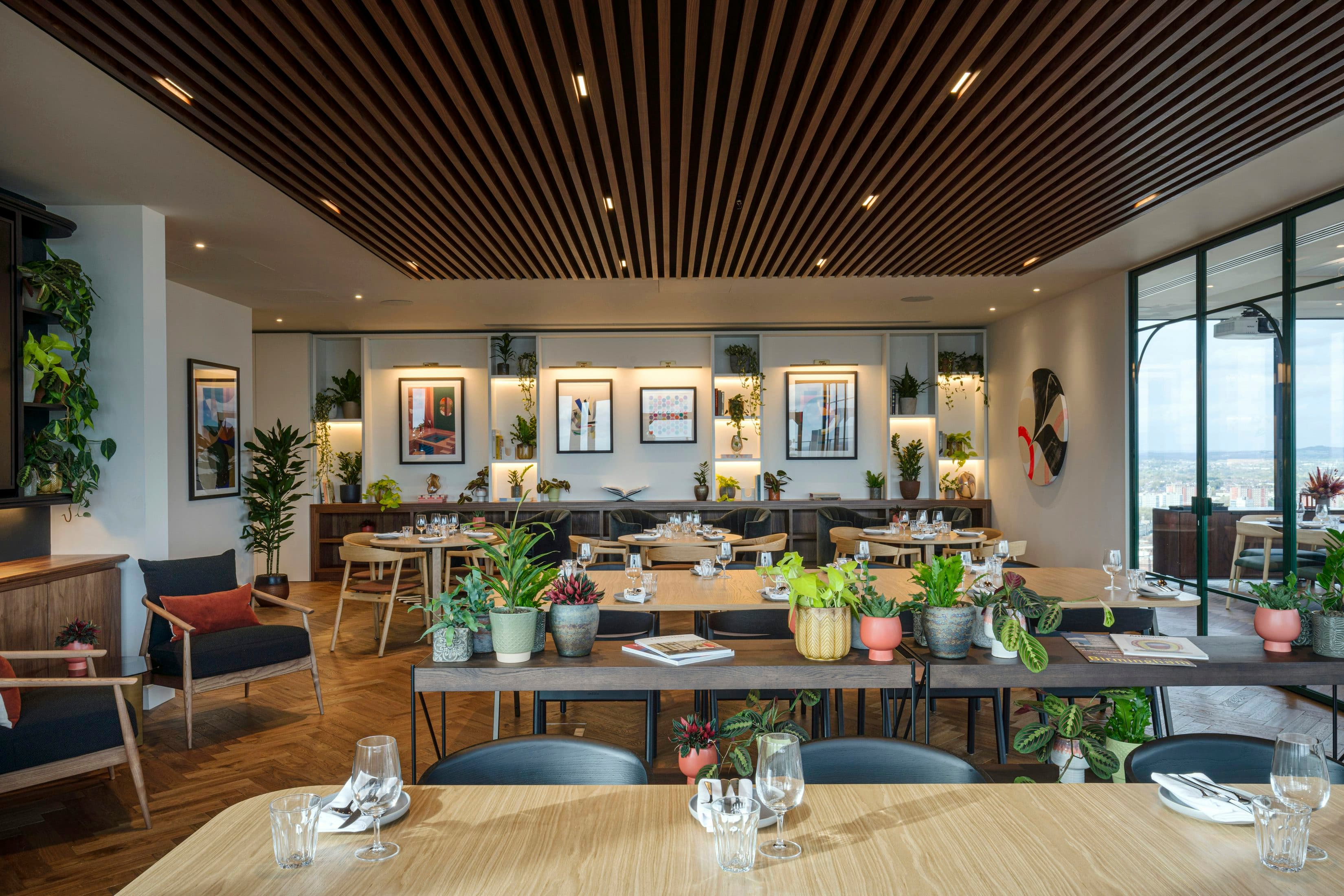 Elegant rooftop event space with biophilic design for corporate gatherings and networking mixers.