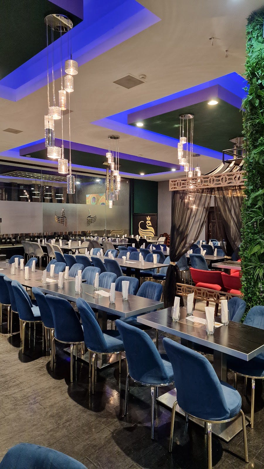 Royal Shalimar banquet hall with communal seating for corporate mixers and formal dinners.