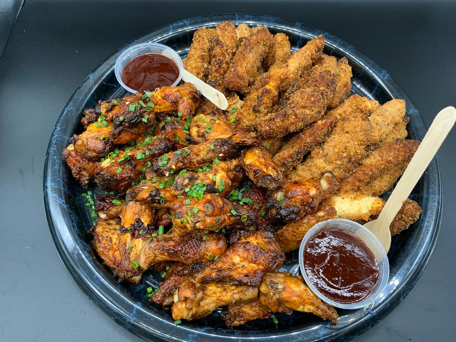 Catering platter of chicken wings and tenders for networking lunch or corporate event.