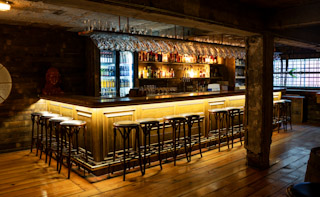 Ludwig's Tavern at Albert's Schloss: rustic networking space with bar seating for corporate events.
