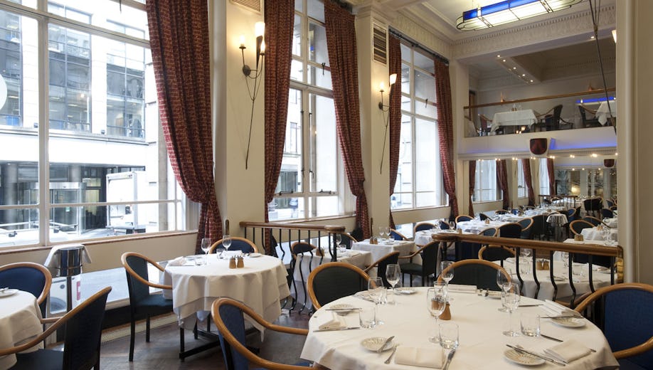 Sophisticated restaurant dining space for corporate events with elegant tableware.