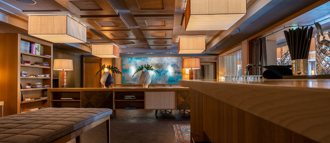 Sophisticated LOUIS Grillroom lounge with warm wood decor for executive networking and receptions.