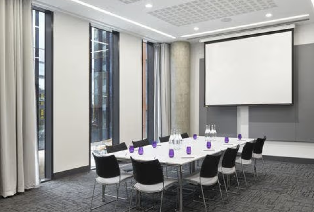 Modern meeting room in INNSIDE Manchester, perfect for seminars and workshops.