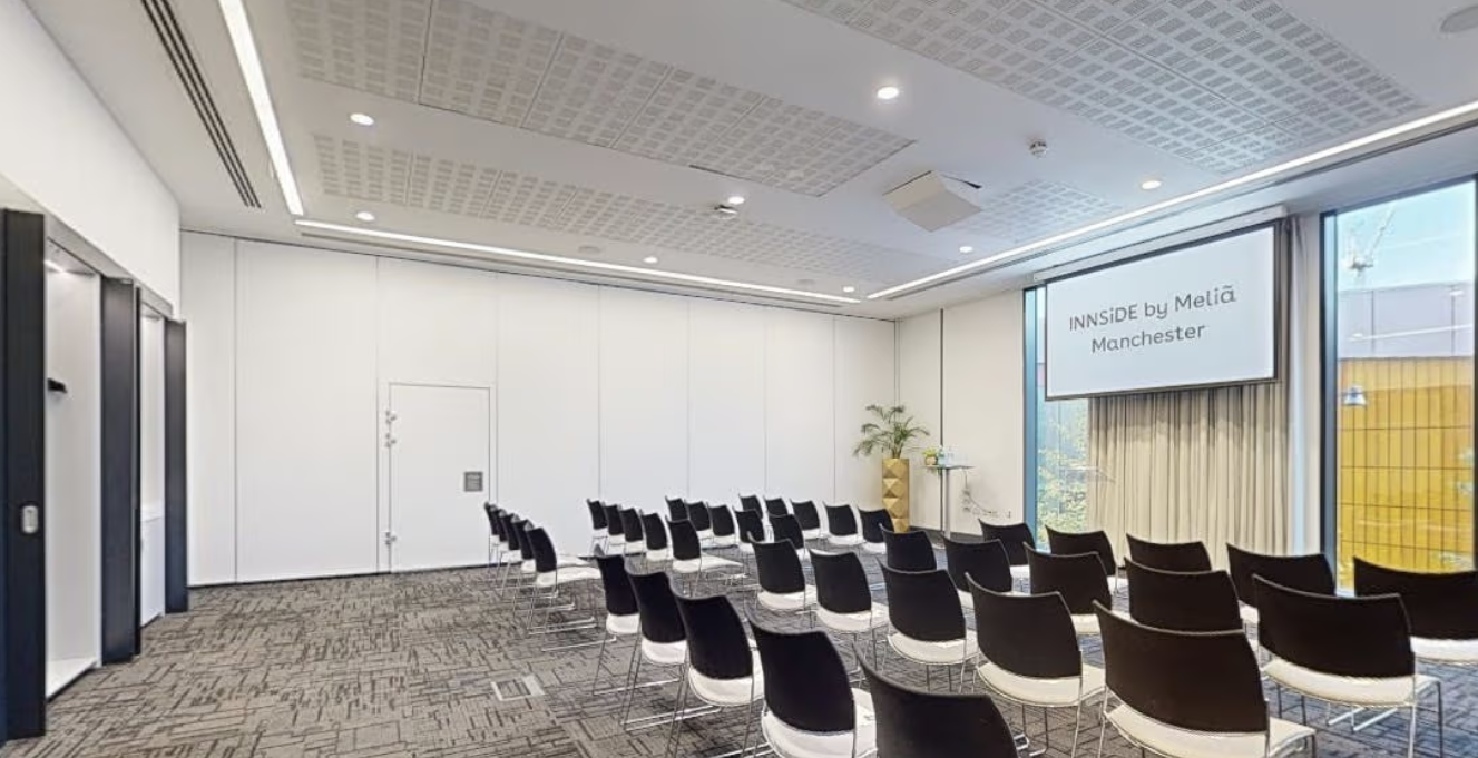 Modern meeting room in INNSIDE Manchester, perfect for conferences and workshops.