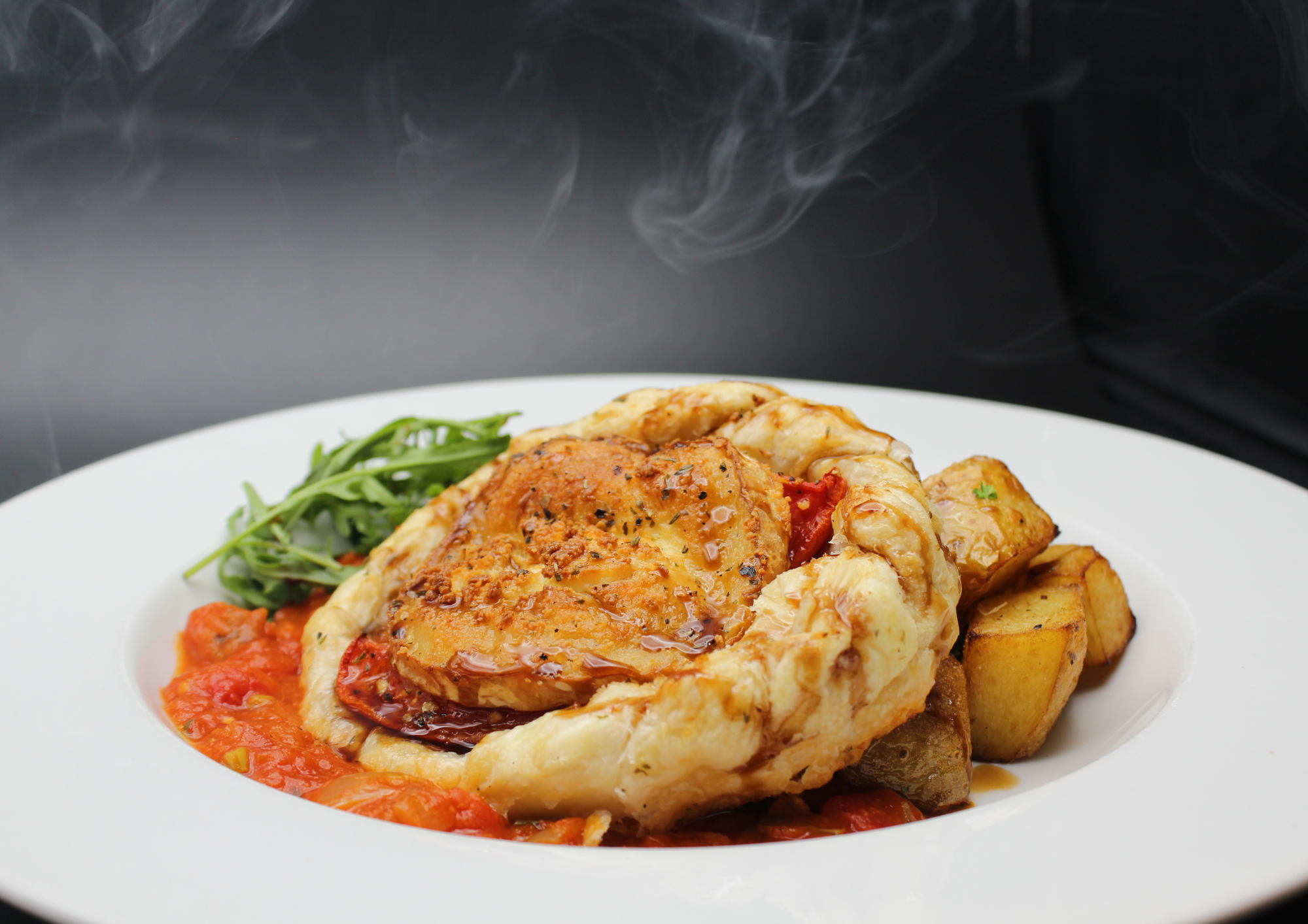 Bistro Live Leicester banquet entrée: steaming rustic dish for corporate events and party catering.