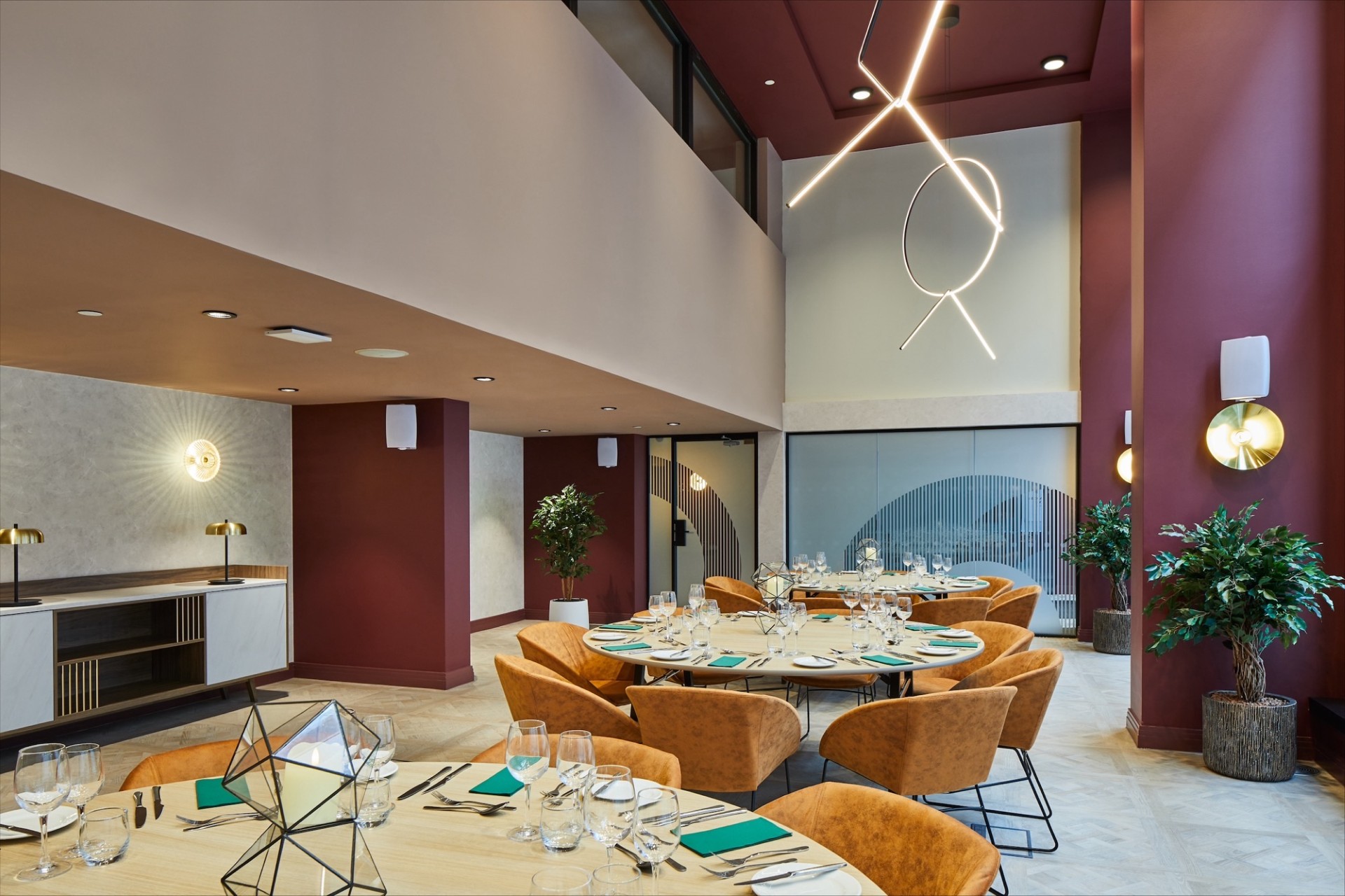 Upscale meeting space at Leonardo Royal Hotel St. Paul's with round table setup for events.