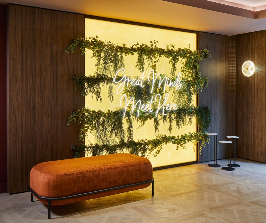 Stylish event space at Leonardo Royal Hotel London with vibrant greenery backdrop. 