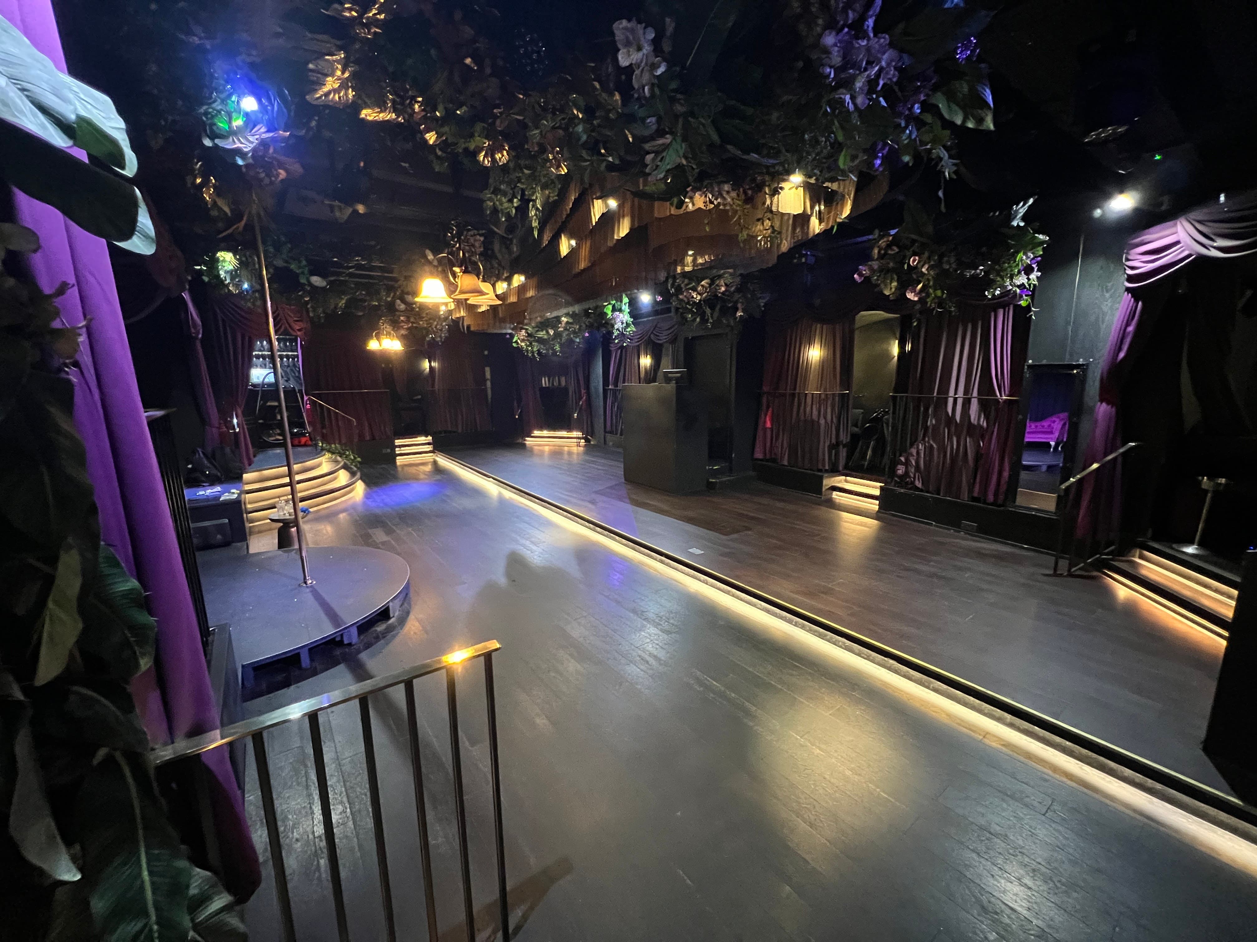 Soho venue with elevated stage and dramatic lighting for gala parties and VIP events.