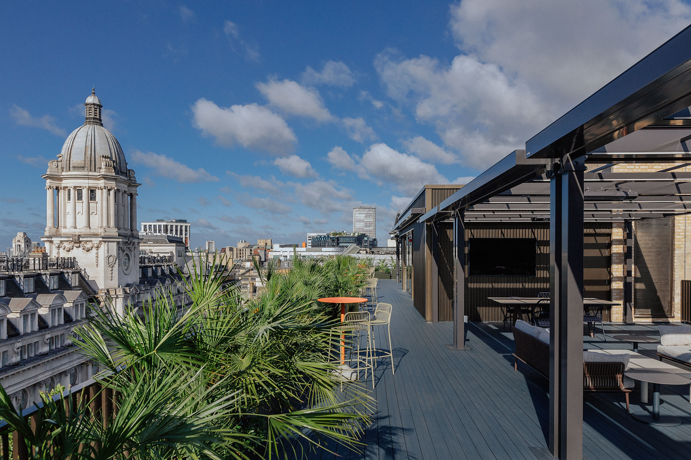 Sleek Central London rooftop venue with greenery, ideal for corporate events and gatherings.