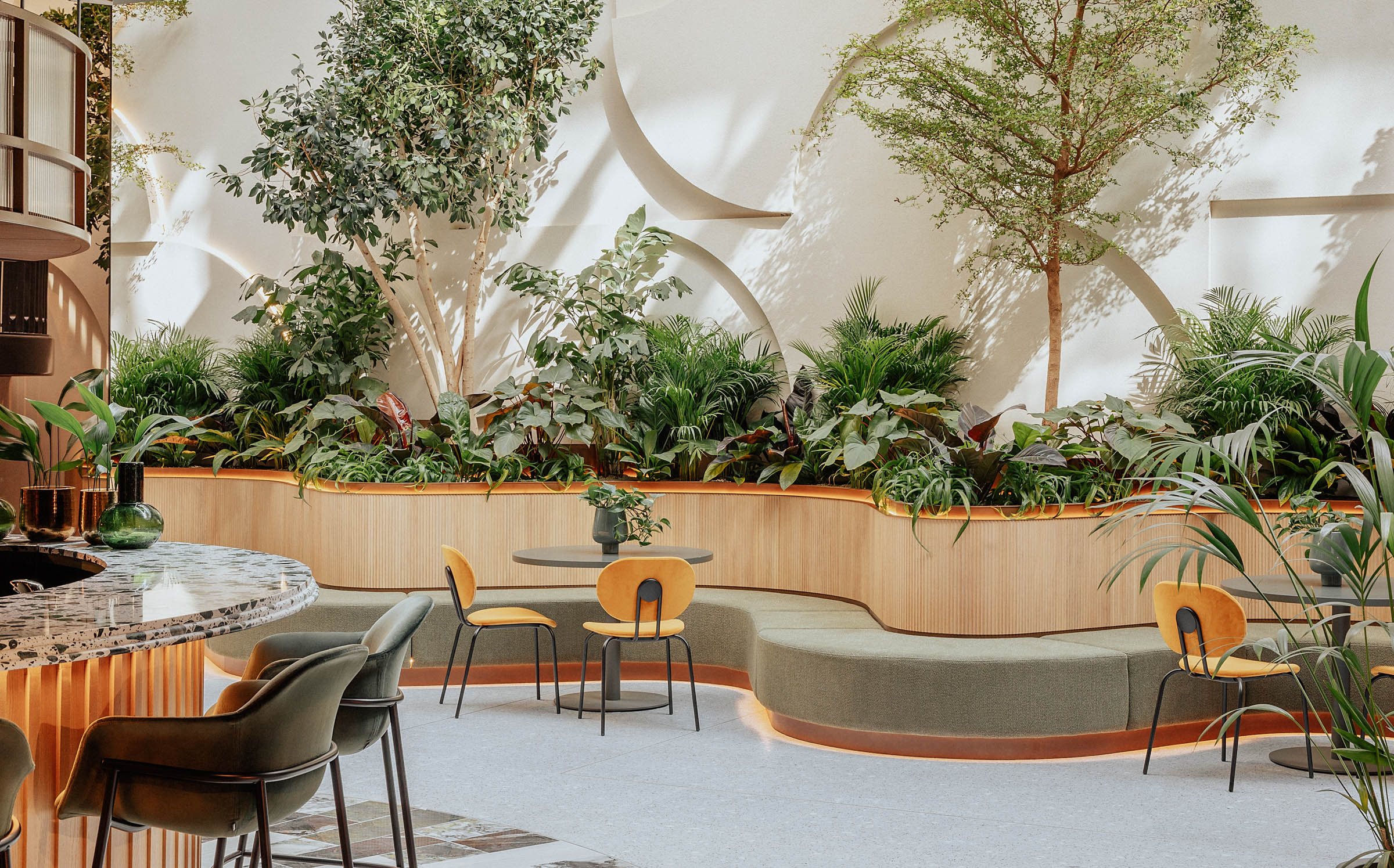 Central London lounge event space with greenery, ideal for meetings and gatherings