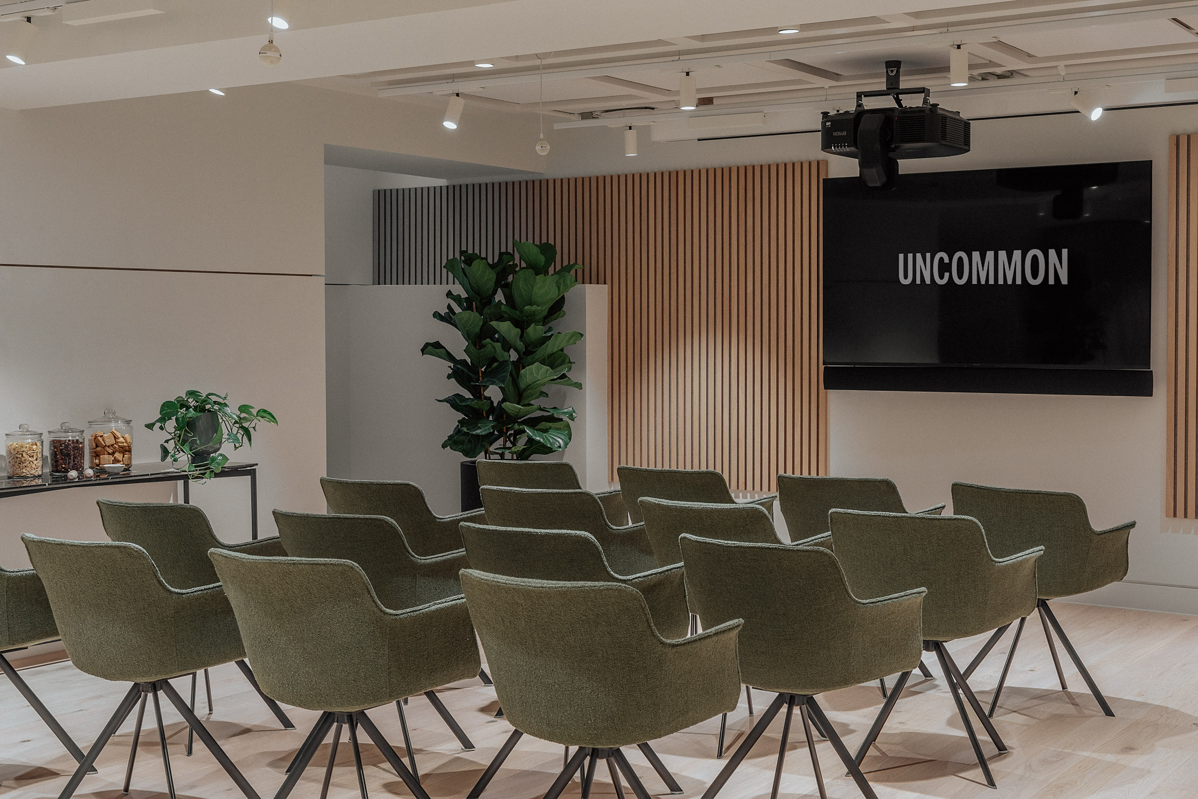 Flexible Board Space with green chairs for meetings and workshops in Uncommon Holborn.