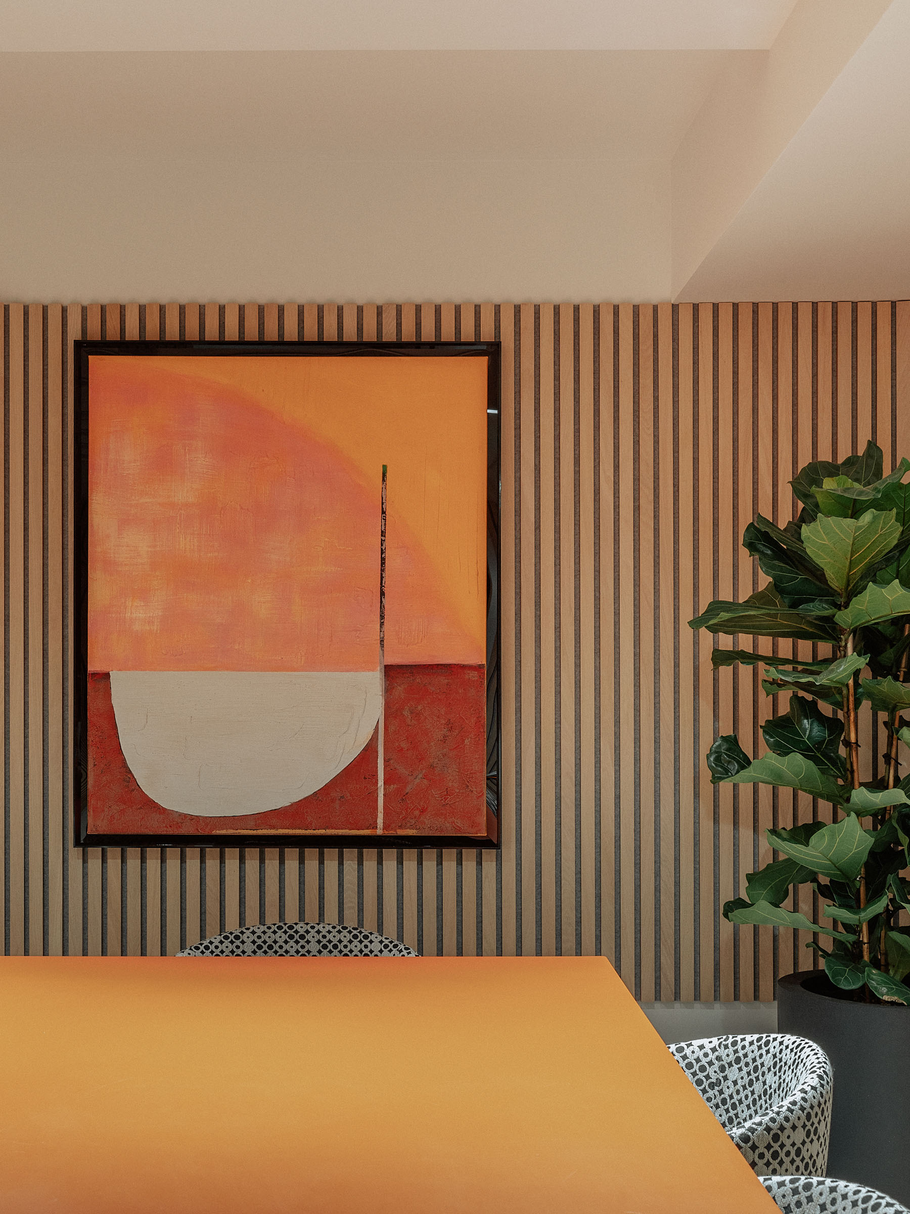 Inviting Meeting Room 2 with vibrant art, ideal for creative events and professional meetings.