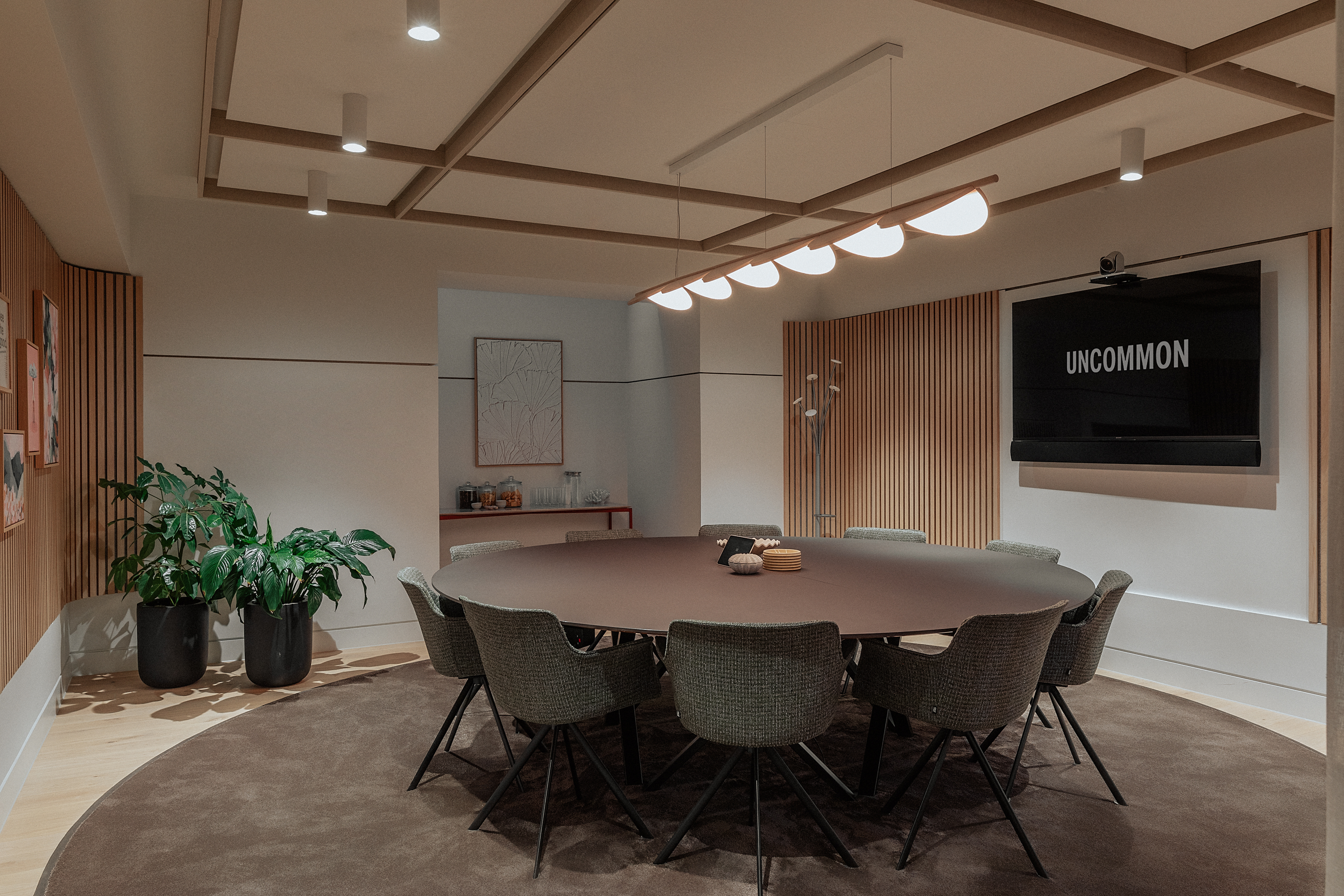 Sophisticated Meeting Room 6, round table and soft lighting for productive meetings.