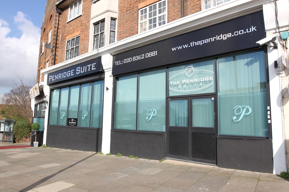 Exterior of The Penridge Suite, featuring large windows for events and meetings.