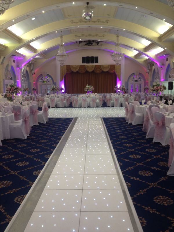 Elegant Penridge Suite event space with illuminated dance floor for weddings and galas.