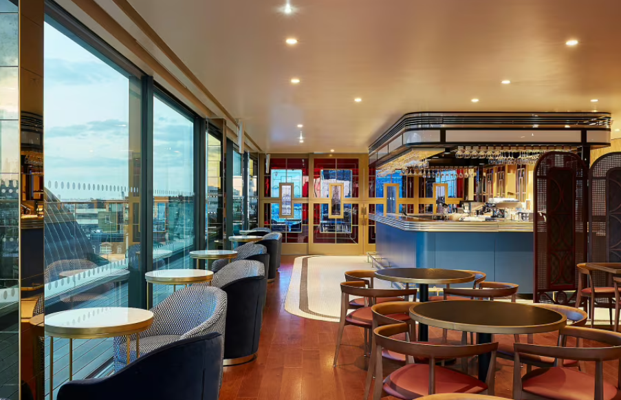 Luxury 1 Leicester Square rooftop venue with floor-to-ceiling windows for cocktail networking.