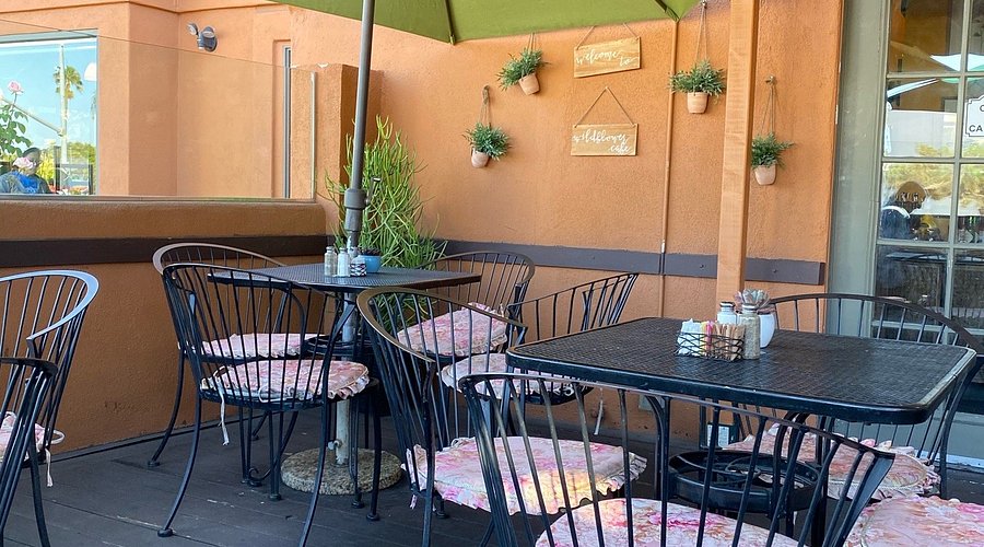 Outdoor patio at Wildflower Cafe, featuring metal furniture for informal networking and events.