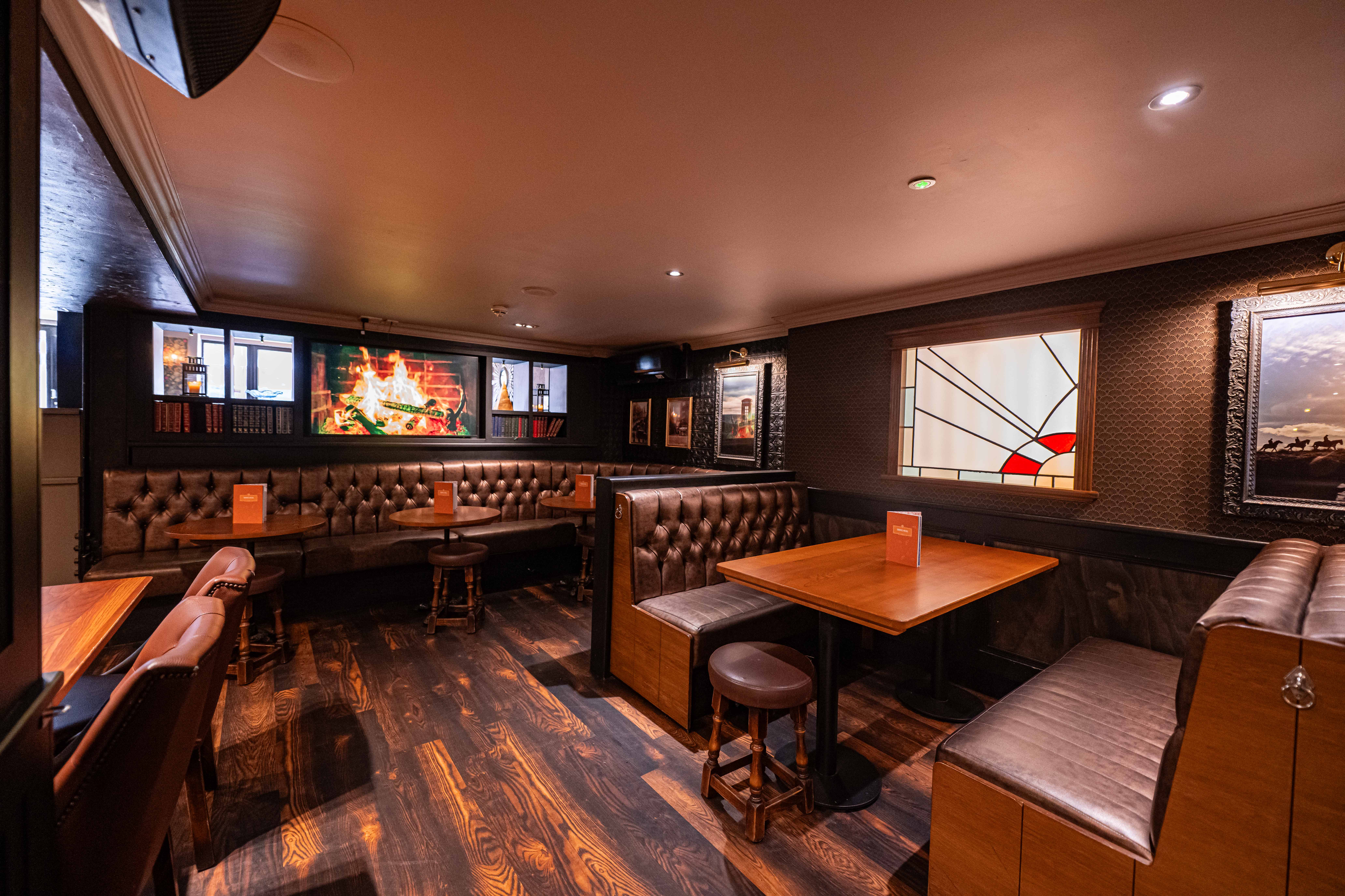 Cozy leather seating in The Garrison, Peaky Blinders Manchester for team-building events.