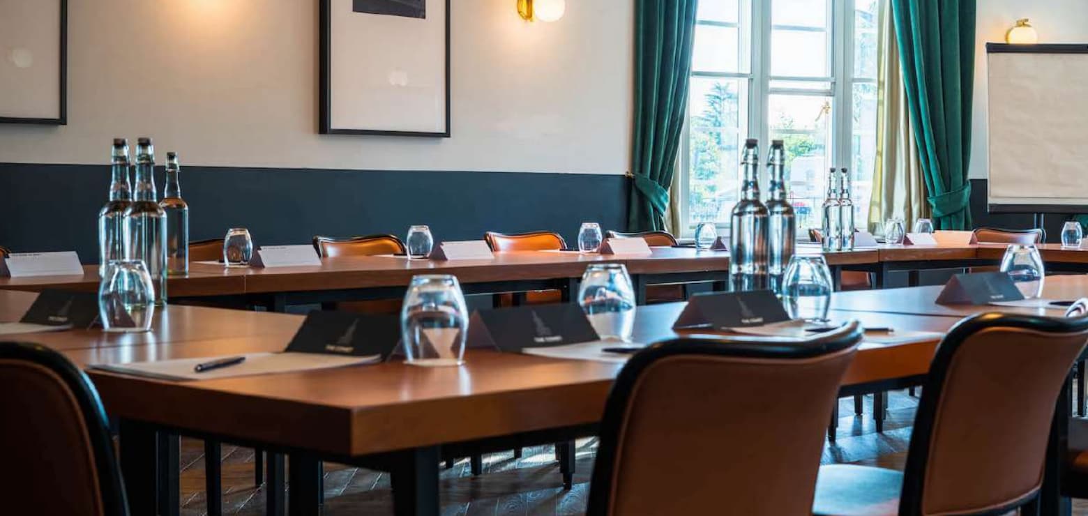 U-shaped boardroom at The Comet Hotel with natural light, perfect for corporate events and meetings.
