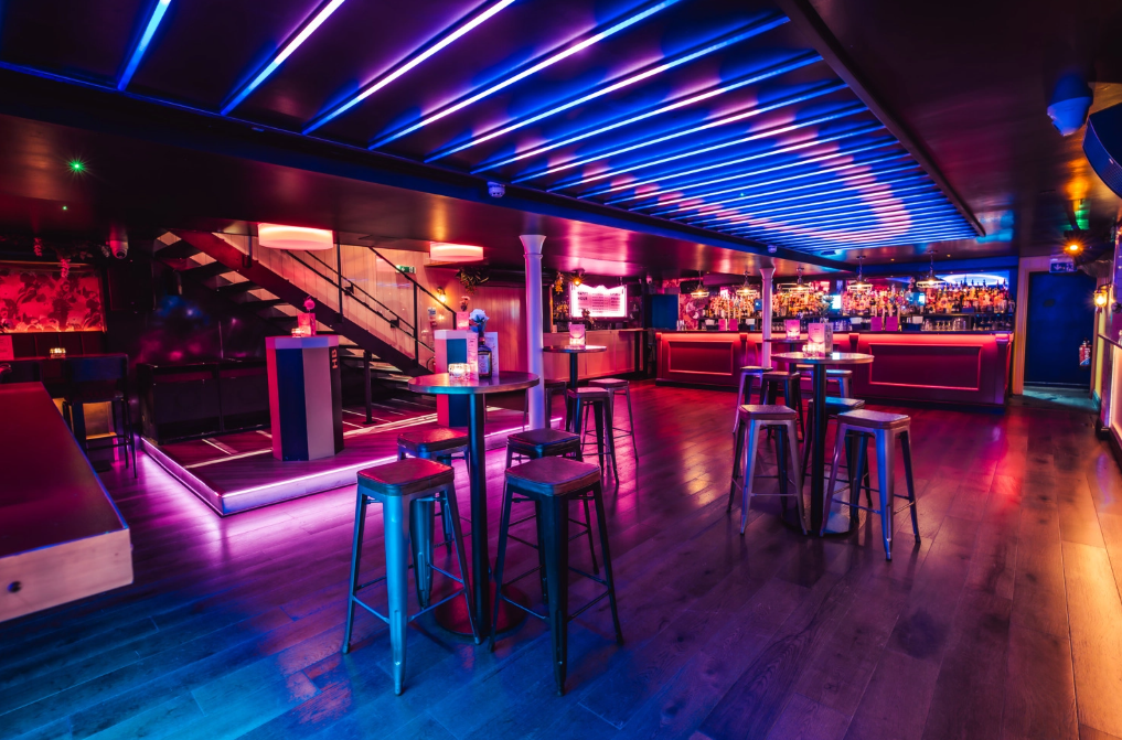 Vibrant event space in Simmons Shoreditch with dynamic lighting for networking and gatherings.