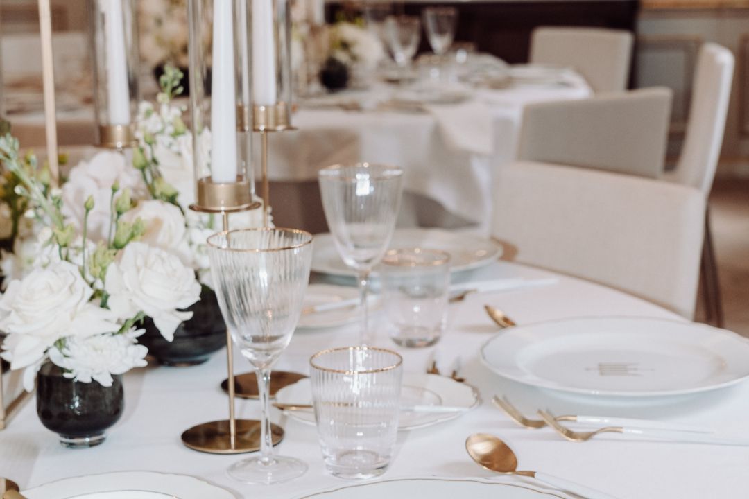 Grand ballroom in Rosewood Munich with elegant dining setup for upscale events.