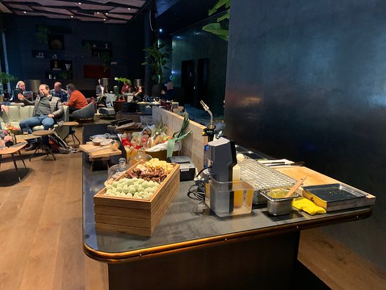 Stylish bar event space at Clarion Hotel® The Hub, perfect for networking and social gatherings.