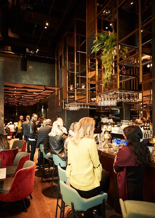 Vibrant bar at Clarion Hotel® The Hub, ideal for networking events and social receptions.