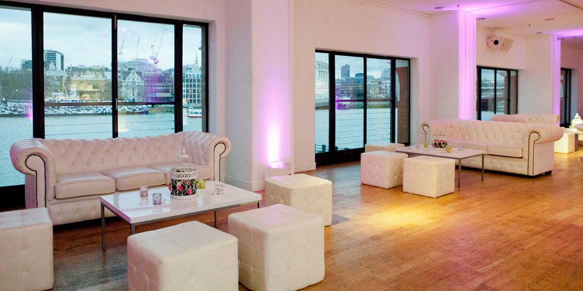 Elegant event space in OXO2 with waterfront views and purple lighting for networking events.