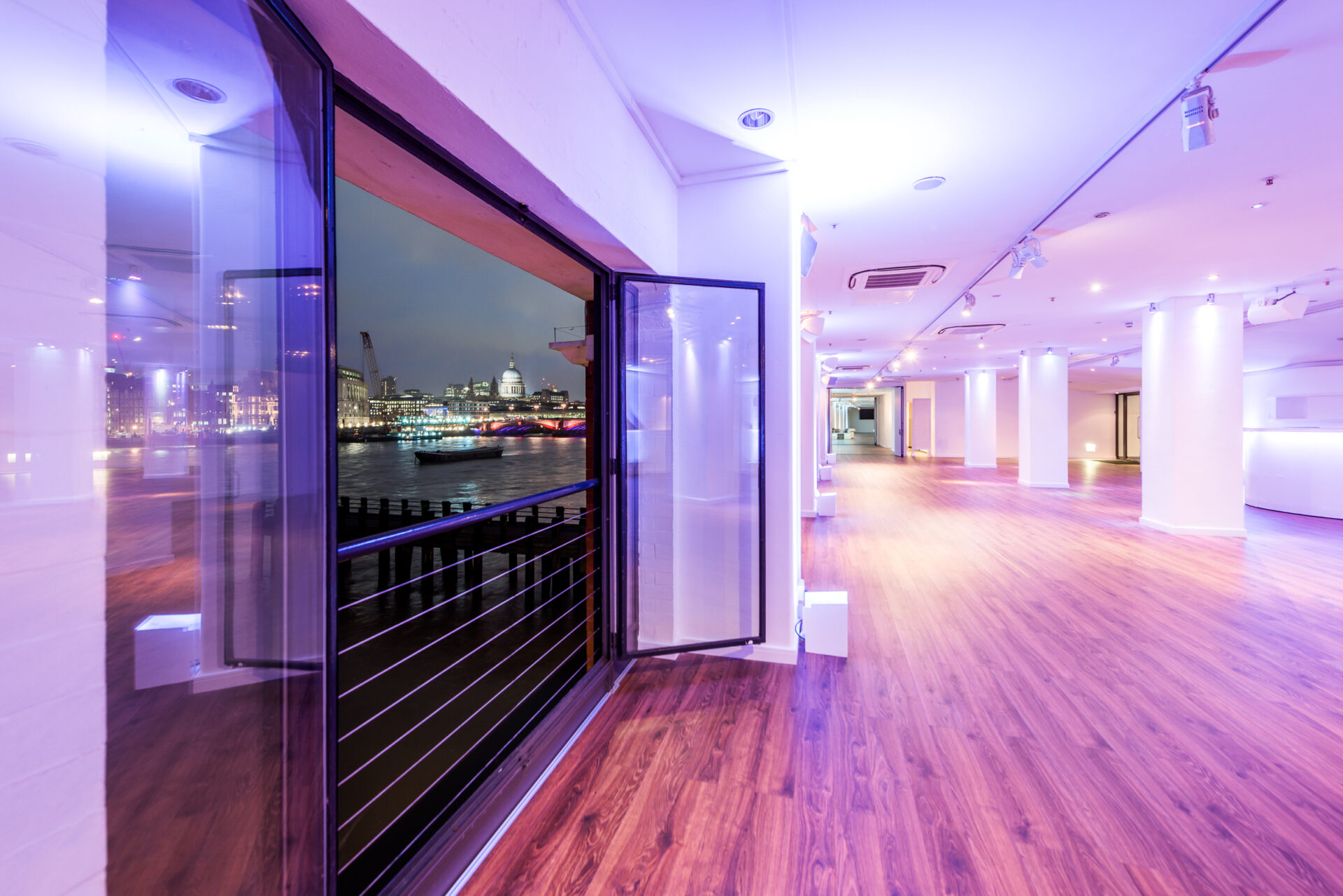 Sleek OXO2 event space with expansive windows for corporate and social gatherings.