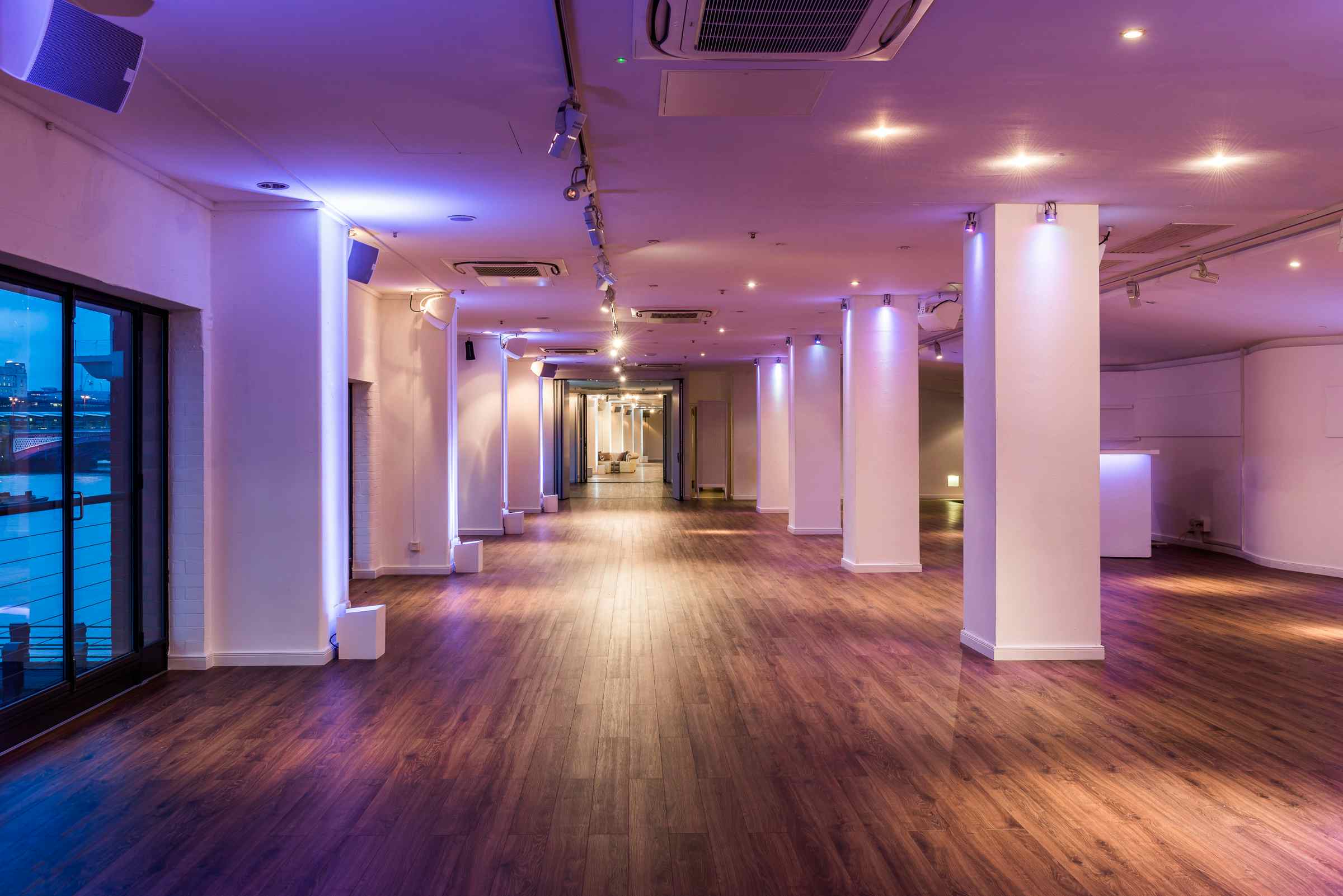 Spacious OXO2 event venue with sleek wood flooring for meetings and gatherings.