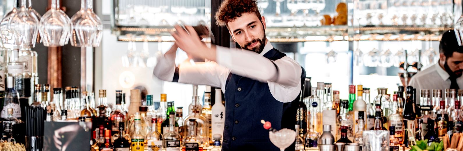 Bartender shaking cocktail at 3 Bar, perfect for social events and networking.