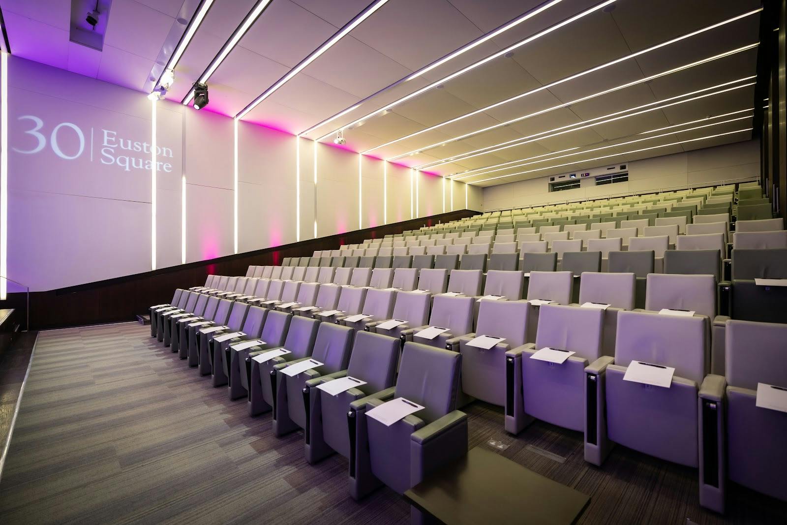 Modern auditorium with tiered seating for corporate events at 30 Euston Square.