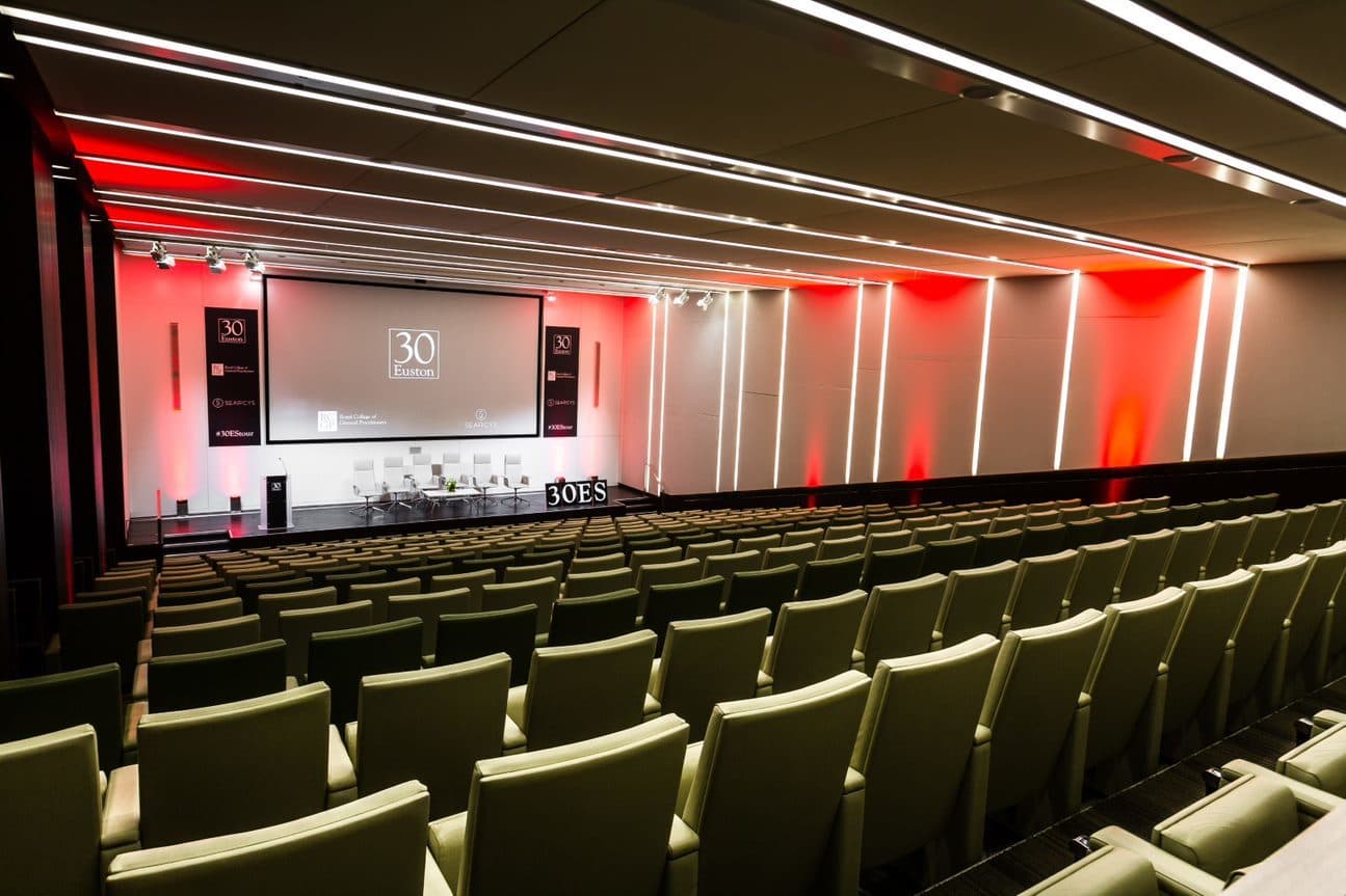 Elegant conference room with tiered seating at 30 Euston Square for corporate events.