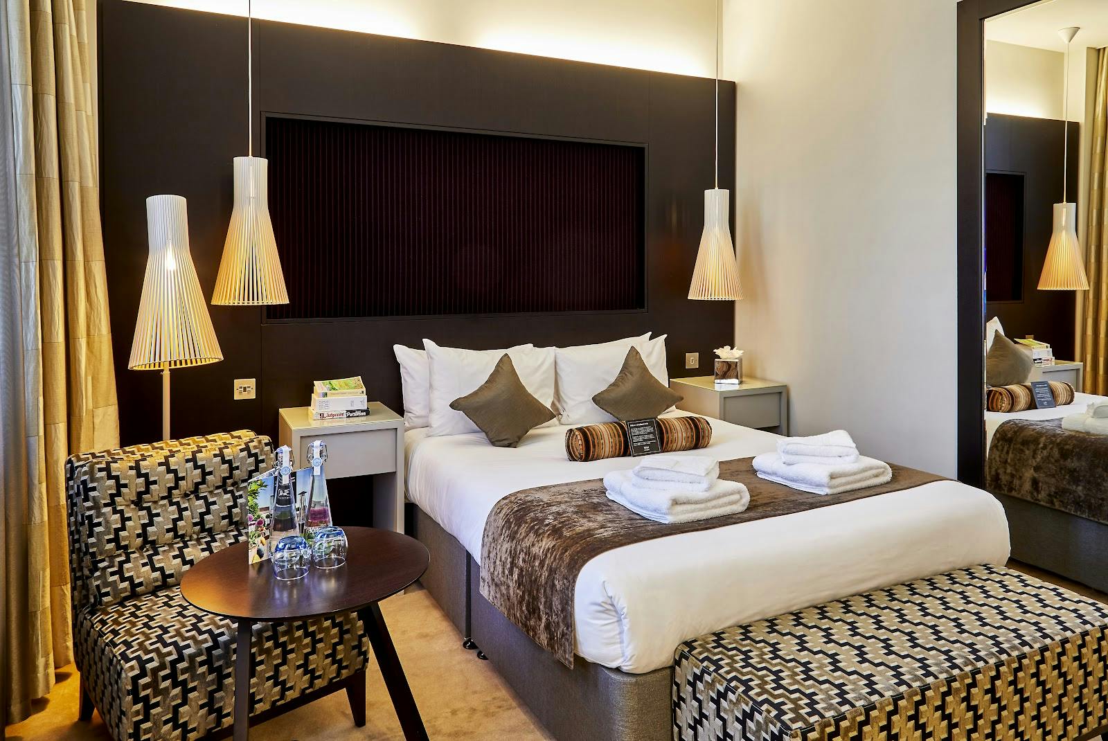 Stylish hotel room at 30 Euston Square for conference attendees with ample natural light.