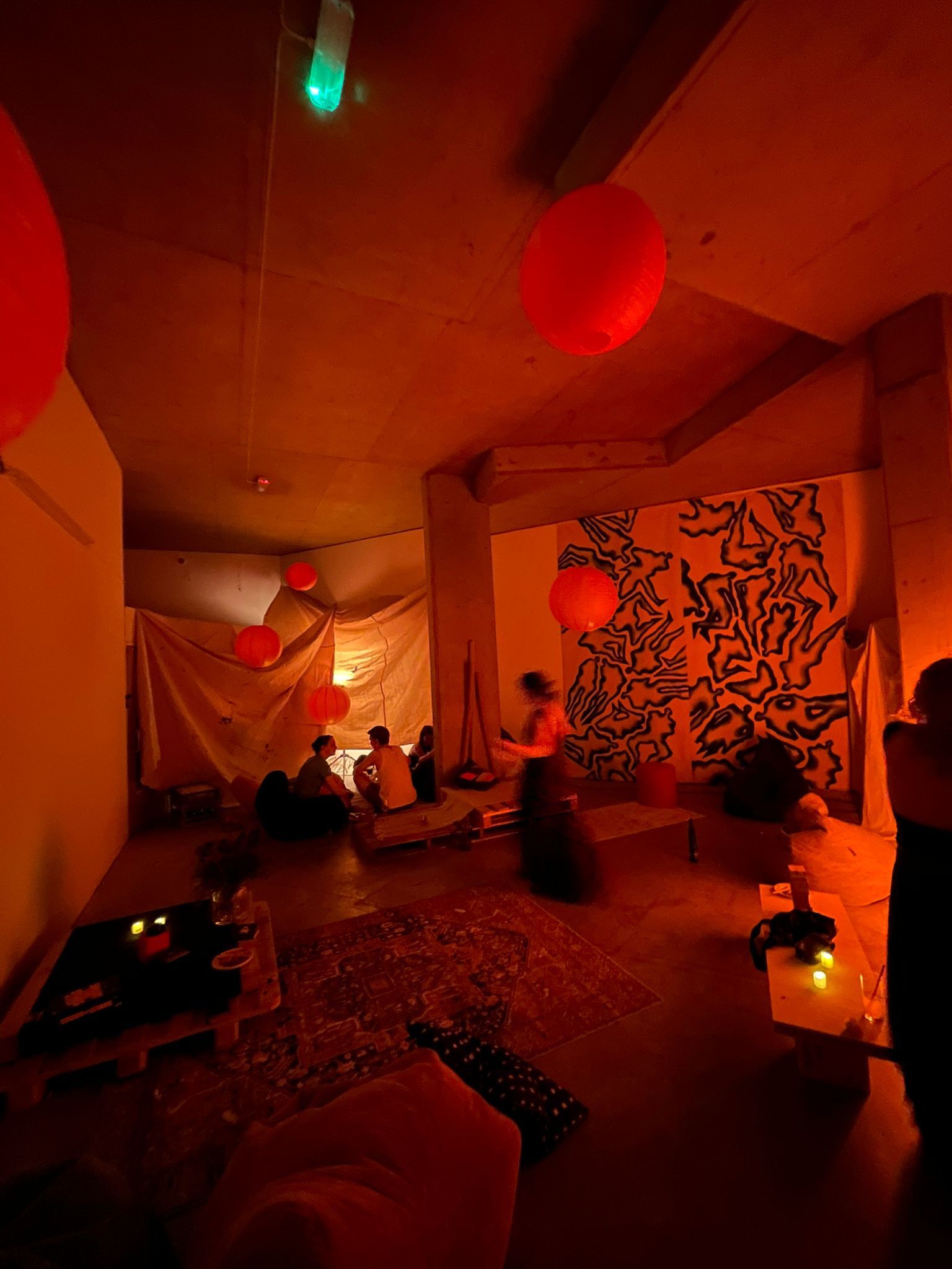 Creative event space with warm lighting, ideal for intimate gatherings and workshops.