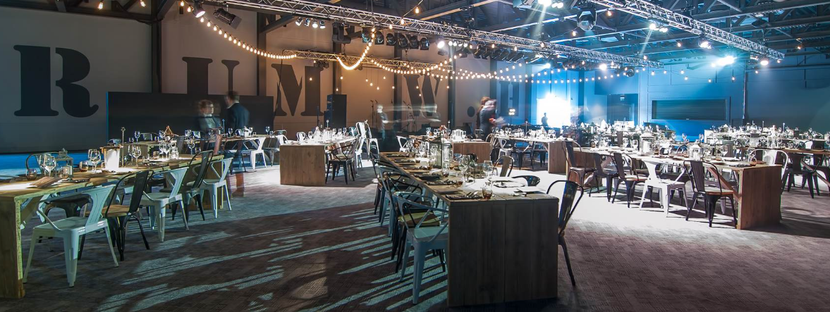 Versatile event space with elegant dining tables at Titanic Hotel Liverpool.