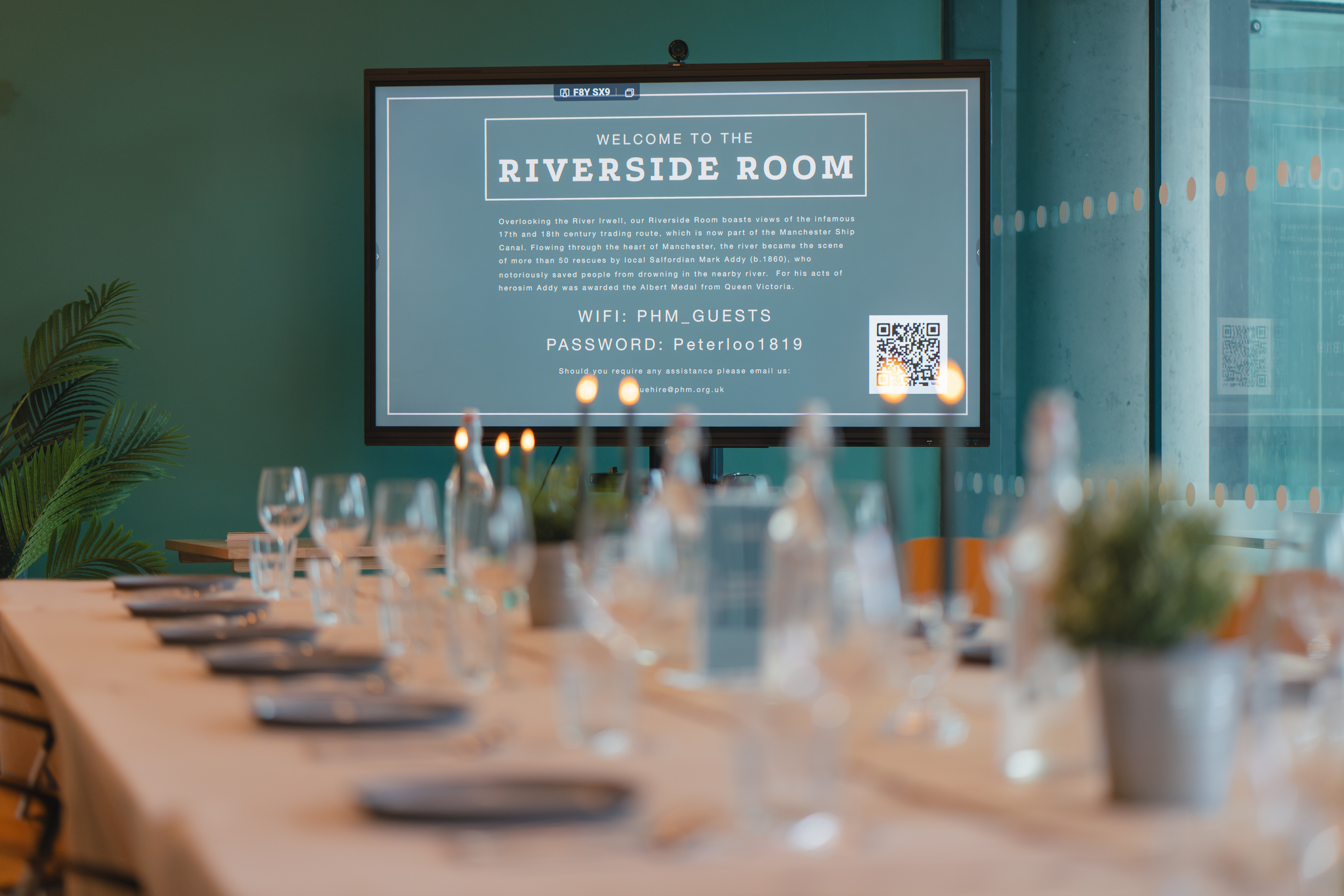 Riverside Room at People's History Museum with elegant table setup for corporate meetings.